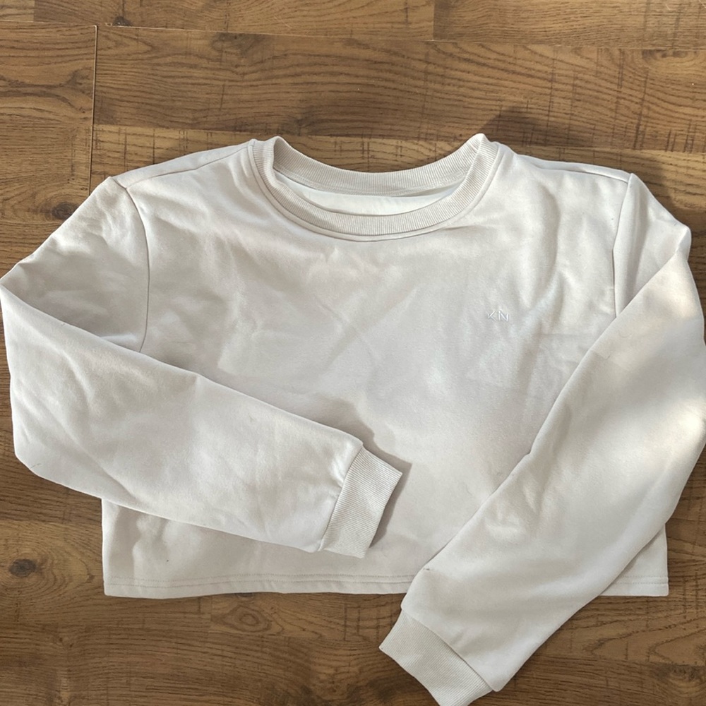Cream coloured cropped sweater with built in bra